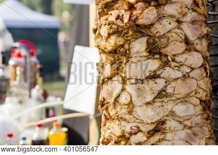 Delicious Slabs Of Skewered Fast Food Shawerma Chicken Meat Turn  On A Spit.