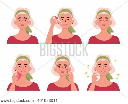 Senior Woman With Bottle Of Face Serum, Facial Gua Sha Stone And Roller. Old Woman Massaging Her Fac
