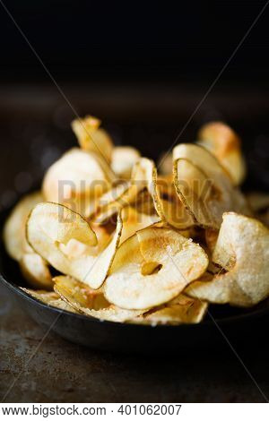 Close Up Of Rustic English Pub Grub Ribbon Cut Potato Crisps