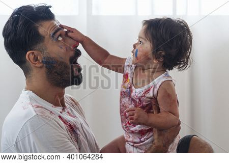 Mixed Race Kid And Parent Or Father Day Concept. Enjoyment Daughter Playing Color And Holding Hand C