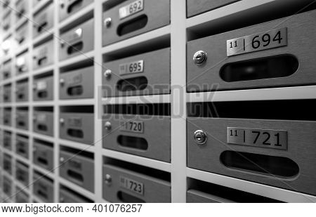 Modern Mail Box Of Apartment Filled Home Numbers Of Resident. Mailbox In A Row In Letter Box Office 