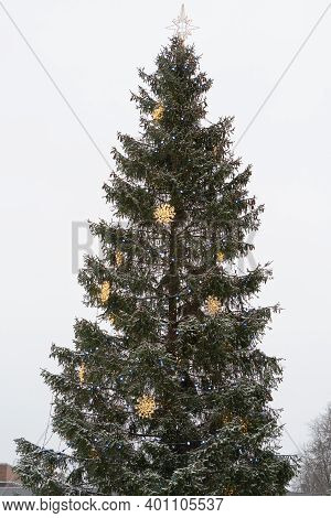 Decorated Spruce In The City. Decorated Top. ... Winter Has Come Concept. Happy New Year Greetings. 