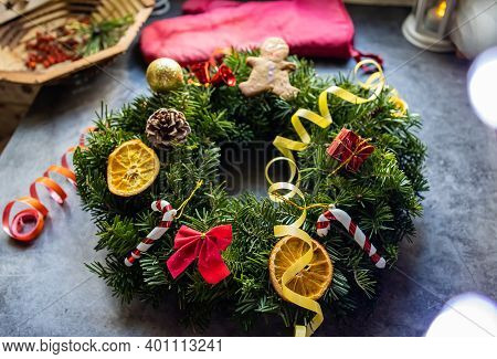 Women Making Christmas Wreath. New Year Holidaydecoration