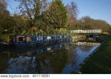 Bath, Somerset, United Kingdom - December 27, 2020: Narrowboats Illuminated By The Early Morning Win