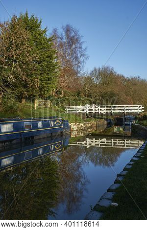 Bath, Somerset, United Kingdom - December 27, 2020: Narrowboats Illuminated By The Early Morning Win