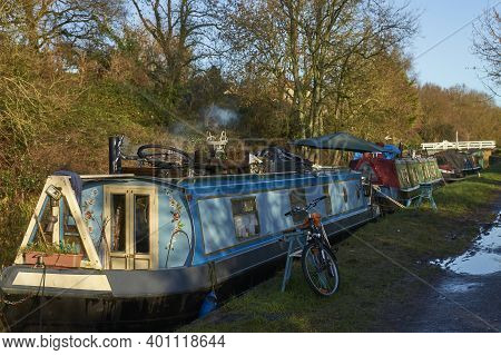 Bath, Somerset, United Kingdom - December 27, 2020: Narrowboats Illuminated By The Early Morning Win