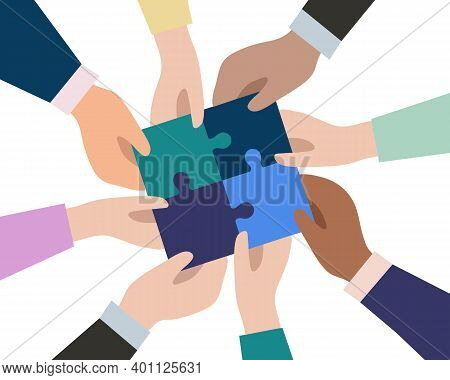 The Hands Of Businessmen Connect The Pieces Of Puzzles Into A Single Whole. The Concept Of Successfu