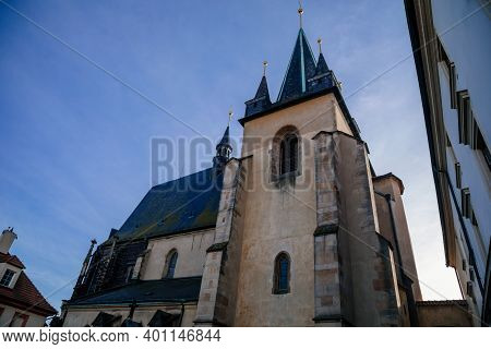 Gothic Church Of Saint Gothard With Bell Towers In Old Historic Center Of Medieval Royal Town Slany 
