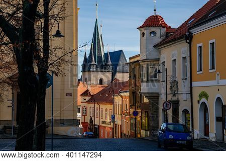 Narrow Picturesque Street With Colorful Buildings In Historic Center In Medieval City Slany, Renaiss