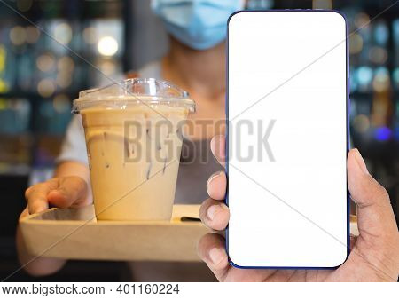 A Smartphone With A Blank Screen For Writing Messages And Designs With Clipping Path. Staff Holds Co