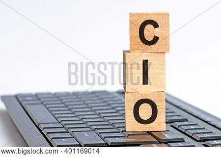 Motivational Words: Cio In 3d Wooden Alphabet Letters On A Keyboard Background With Copy Space, Busi
