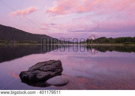 Boulder Rests In Snake River At Oxbow Bend At Sunrise In Grand Teton National Park
