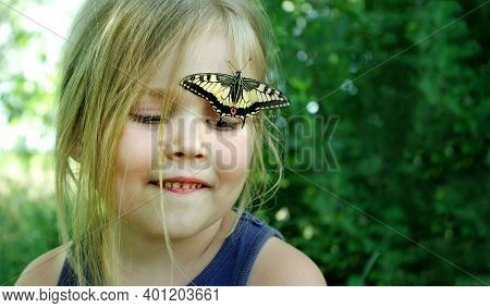 Girl And Butterfly. Colorful Swallowtail Butterfly Sitting On A Child. Colorful Summer Background. S