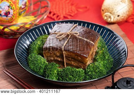 Dong Po Pork Meat In A Blue Plate With Broccoli With Red Background.