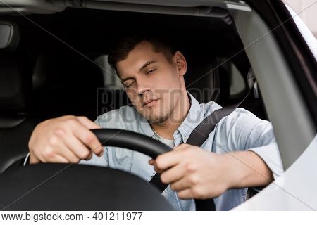 Drunk Man Fall Asleep While Driving Car, Blurred Foreground.