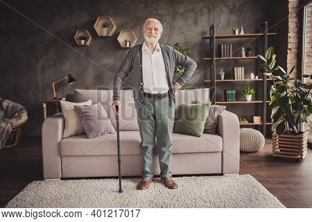 Full Length Photo Of Funny Old Man Dressed White Shirt Standing With Help Walking Cane Indoors Flat 