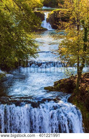  The forest surround the Korana river. Trip to Croatia. The smal town of Slunj. Magnificent cascade of waterfalls on the river. The concept of ecological, active and photo tourism