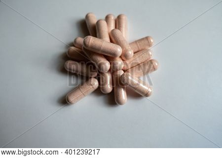Group Of Pink Capsules Of Probiotic Dietary Supplement