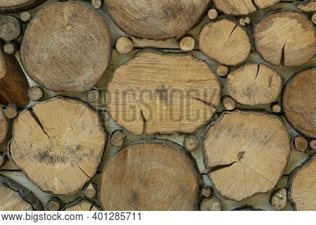Close Up Image Of Wooden Background Made Of Cutted Round Wood Secrions Different Sizes And Shapes. N