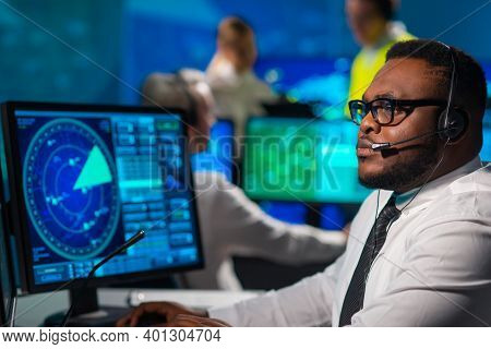 Workplace Of The Air Traffic Controllers In The Control Tower. Diverse Team Of Aircraft Control Offi