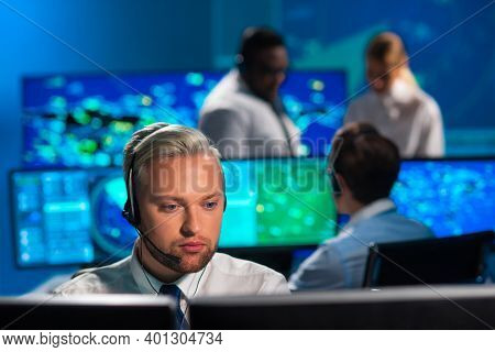 Workplace Of The Air Traffic Controllers In The Control Tower. Diverse Team Of Aircraft Control Offi
