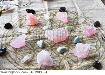 A Close Up Image Of A Self Love And Self Healing Crystal Grid Using Sacred Geometry And Rose Quartz 