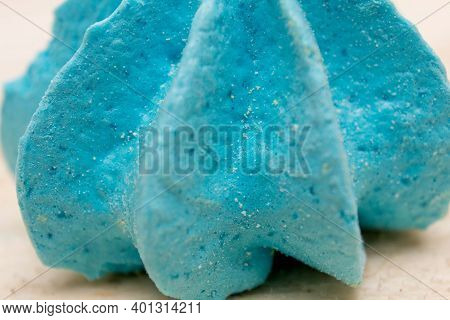 Blue, Sweet, Crispy Meringue Close-up On A Wooden Background.