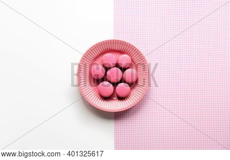 Pink Macaroons On A Plate. Simple Monochrome Flat Lay On Split Two Tone Pink White Background. Creat