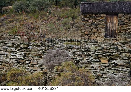 Cabin And Rock Wall In The Monfrague National Park. El Cardenal. Monfrague National Park. Caceres. E