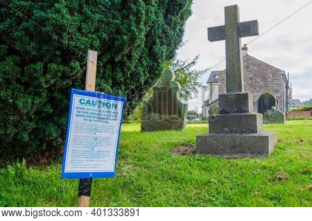 Llandegla; Uk: Sep 20, 2020: A Warning Sign Draws Attention To The Fact That There Are Some Headston