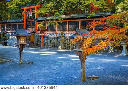 Tradtional Japanese Torii Gates Of Shinto Shrine With Wooden Lanterns At Koyasan Mountain At Fall.