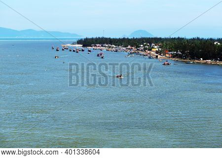 Hoi An, Vietnam, December 29, 2020: Fishing Port At The Mouth Of The Thu Bon River In Hoi An, Vietna
