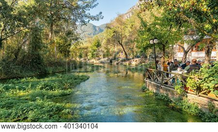 Marmaris, Akyaka, Turkey - November 2020: People Eating By The Azmak River In Akyaka Village Of Mugl