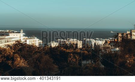 An Evening Cityscape Of A Dormitory Area Near The Sea With Multiple Multi-story Residential Building