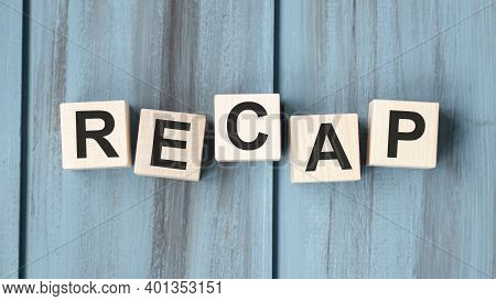 Concept Word Recap On Wooden Cubes On A Gray Background