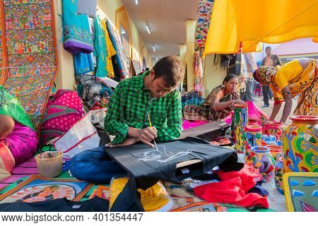 Kolkata, West Bengal, India - 31st December 2018 : Young Bengali Male And Female Artists Painting Pa