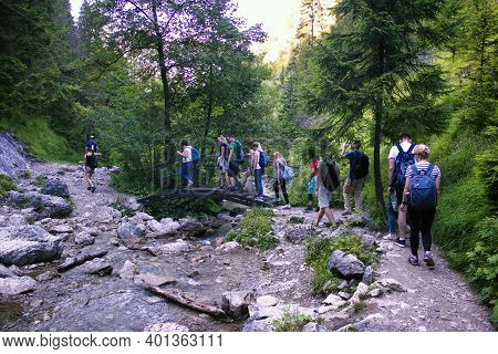 Bielsko Biala, South Poland - July 29, 2017: Bunch Of Young People Trekking Hiking In The Polish Bes