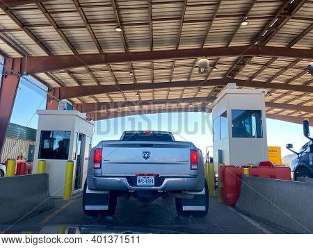 A Person In A Truck Beinging Questiond At A Usa Border Patrol Checkpoint.