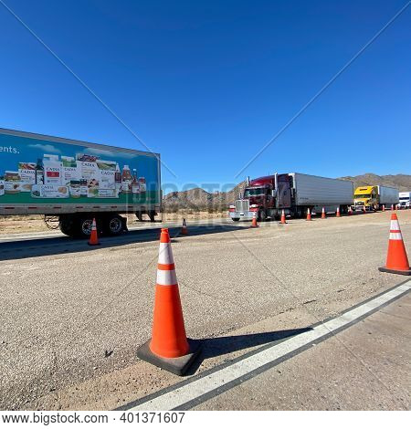 Texas Usa - February 24,2020:  A Line Of Trucks Waiting At A Usa Border Patrol Checkpoint To Be Ques