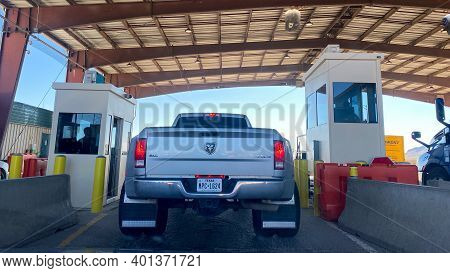 A Person In A Truck Beinging Questiond At A Usa Border Patrol Checkpoint.