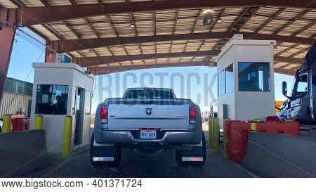 A Person In A Truck Beinging Questiond At A Usa Border Patrol Checkpoint.