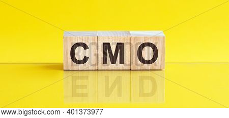 Motivational Words: Cmo In 3d Wooden Alphabet Letters On A Bright Yellow Background With Copy Space,