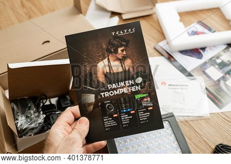 Paris, France - Dec 8 2020: Pov Male Hand Reading Flyer With Multiple Video Tools For Professionals 