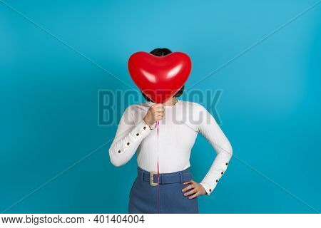 Mock Up Brunette Woman Hides Her Face Behind A Red Heart-shaped Balloon, Depersonalized, Isolated On