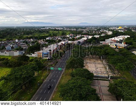 Aerial View Of Grandwisata Bekasi, Builidings, Park, Roundabout With Bekasi Cityscape Background. Ja