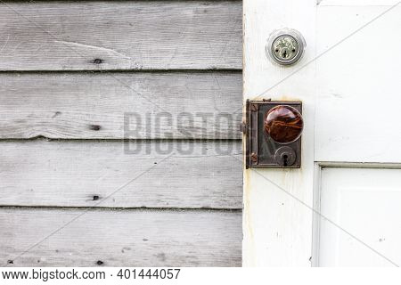 Vintage Wooden Door With New Deadbolt Lock For Security.