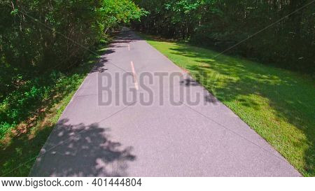 Paulding County, Ga Usa - 06 11 20: Paved Trail View And Green Foliage In The Summer Silver Comet Tr