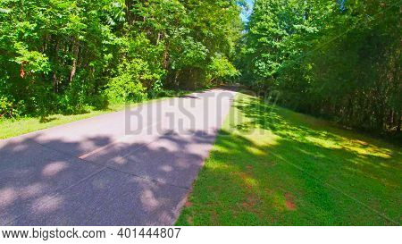 Paulding County, Ga Usa - 06 11 20: Angled Trail View And Green Foliage In The Summer Silver Comet T