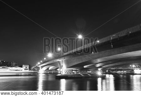 Landscape Of Phra Pok Klao Memorial Bridge Cross  River In Thailand Cin Night