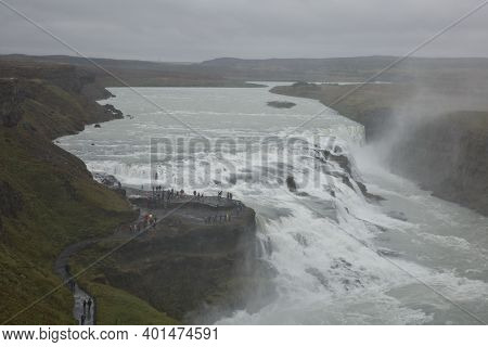 People Visiting And Experiencing The Power Of Popular Tourist Destination - Gullfoss Waterfall On Hv